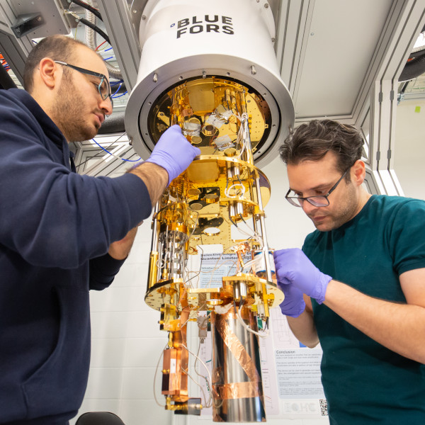 Researchers adjust a quantum fridge