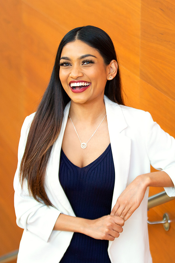 A portrait of a smiling young woman