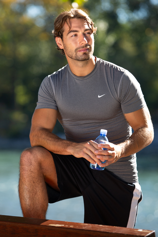 An athlete takes a water break.