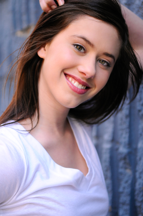 A headshot of a young woman smiling.