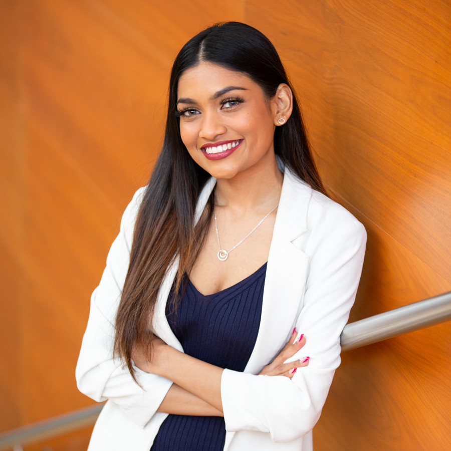 A female professional smiles for the camera.